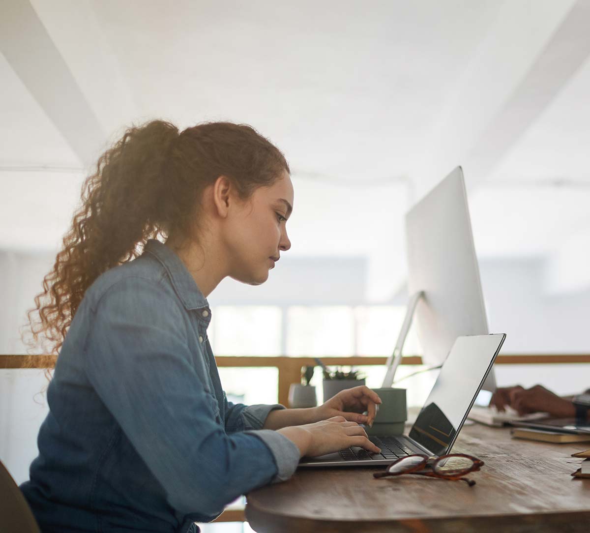 two-young-people-using-computers-in-coworking-spac-2021-09-24-04-09-46-utc